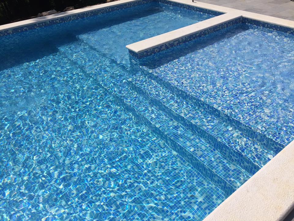 Pool interior with blue mosaic tiling and steps