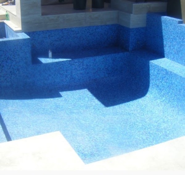 Concrete pool interior with fresh blue mosaic tile finish